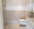Bathroom with shower, toilet, and sink