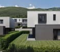 Apartements building, white and grey walls, glass windows, terrace, balcony, grass lawn, bushes