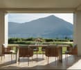 Dine al fresco on a large, covered terrace overlooking stunning mountain scenery