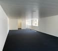 empty room, white walls, black carpet, white ceiling, windows
