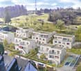New development, multiple buildings, balconies, roofs, gardens
