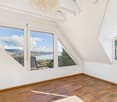 empty room, wooden floor, white walls, large windows, chandelier