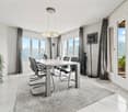 Spacious dining room with large windows offering a scenic view, modern dining table and chairs, pendant lighting fixture, potted plant, and artwork on the wall.