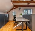 wooden floor, wooden beams, office desk, office chair, round window, window, flower vase