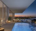bedroom with bed, balcony with lounge chairs, swimming pool, view of the city