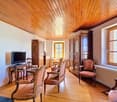 wooden floor, wooden ceiling, fireplace, TV, wooden furniture, radiator