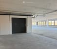 empty, concrete floor, steel beams, white walls, double door