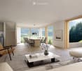 Spacious open-plan living room with large windows offering a scenic view of the surrounding countryside. The room features a dining area with a wooden table and chairs, a comfortable seating area with a sofa and armchair, and a modern kitchen with gray ca