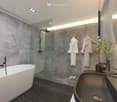 Bathtub, glass shower, wall towels, sink, modern lighting