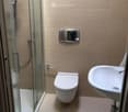 small bathroom with shower and toilet