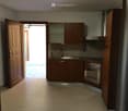 Kitchen, wooden cabinets, tiled floor, sink with faucet, oven, refrigerator