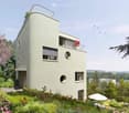 Modern architectural design, white walls, round windows, rooftop balcony, garden, view