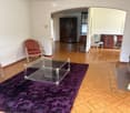 empty room, wooden parquet floor, glass table, fireplace