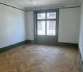 empty room, wooden parquet flooring, large window, white walls, ceiling