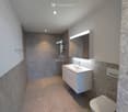 shower area, sink, toilet, white tiles, mirror, modern style