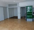 empty room, parquet floor, sliding doors, glass window, tall green storage unit