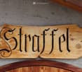 Wooden sign with the word Struffel in stylized font