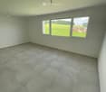 empty room, tile floor, white walls, two windows
