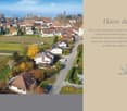 Family villa, red brick, solar panels, nestled in a peaceful and well-maintained residential area with a large garden