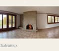 living room with fireplace, large windows
