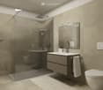 Modern bathroom with shower, white sink, cabinet, and tiles