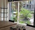 modern dining table, black and white striped mugs, window with view of outdoor