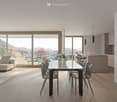 Open concept layout, dining area with white table, balcony with railings, large windows, couch, carpet, modern style