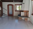 empty room, fireplace, wooden floor, white walls, windows, doors