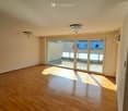 hardwood floors, large glass doors, balcony, chandeliers