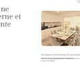 Modern kitchen with a dining area, white cabinets, marble countertops, and a dining table set for six.