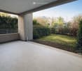 tiled floor, balcony, metal railing, garden, plants, grass