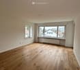 empty room, wooden floor, white walls, two windows, view of the outside