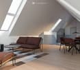 modern attic room with wooden floor, brown sofa, dining table, lamps, carpet