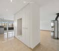Unfurnished Room. Empty room with white walls, tiled floor, built-in wardrobes, and a fireplace.