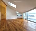wooden floor, white walls, skylight, large windows, sliding doors, kitchen with built-in appliances
