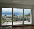 sliding glass doors, balcony, wooden floor, view of the sea and mountains