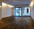 empty room, wooden floor, white walls, glass doors, windows