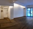 empty room, wooden floor, white walls, glass doors, windows