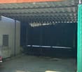 {"visible_features": ["Garage"], "type": "Garage", "objects": [], "description": "Carport with metal roof and chain-link fence, concrete floor, adjacent building with air conditioning unit visible.", "localized_descriptions": {"EN": "Carport with metal ro