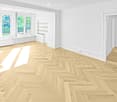 Empty room with light wooden herringbone flooring, white walls, large windows with a view of greenery, and built-in shelving unit.