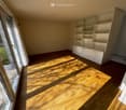 empty room, wooden floor, sliding glass doors, large white cabinet, sunlight