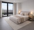 Modern bedroom with a large bed, nightstands, lamps, and a view of the city from a balcony.