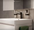 modern bathroom with white sink, black faucet, soap dispenser, toothbrush holder, towel rack, mirror