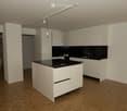 Modern kitchen with white cabinets, black countertops, and a central island. Features include a sink, faucet, and track lighting.