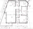 Floor plan of a building showing multiple rooms including a living room, kitchen, bedrooms, bathrooms, and a hallway.