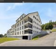 Modern apartment building with multiple floors, balconies, and a garage entrance.