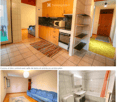 The image shows a furnished apartment with a living room, kitchen, and bathroom. The living room features a blue sofa and a patterned rug. The kitchen has wooden cabinets, a microwave, and an oven. The bathroom includes a sink, bathtub, toilet, and a mirr