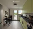 Modern kitchen with light green cabinets, stainless steel appliances, and a dining area with a table and chairs. The space features tiled flooring, a large window, and a door leading to a balcony.