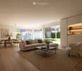 Modern living room with light-colored sofa, coffee table, dining area, pendant light, and large windows overlooking a garden.