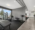 modern decor, chaise lounges, tiled floor, large windows, minimalist furniture